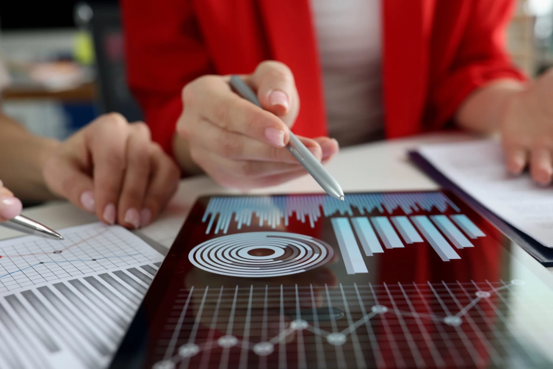 Analyzing digital financial charts and graphs.
