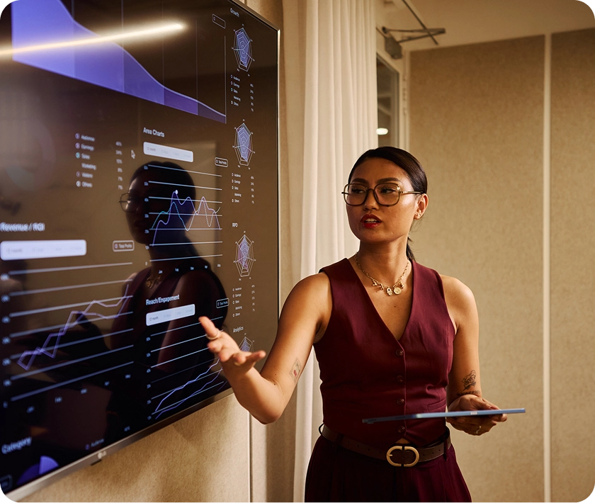 Woman presenting data on a screen.